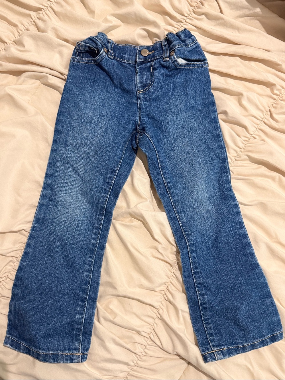 The Children's Place Denim Jeans in Blue with Pink Logo